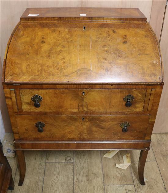A 1950s walnut bureau